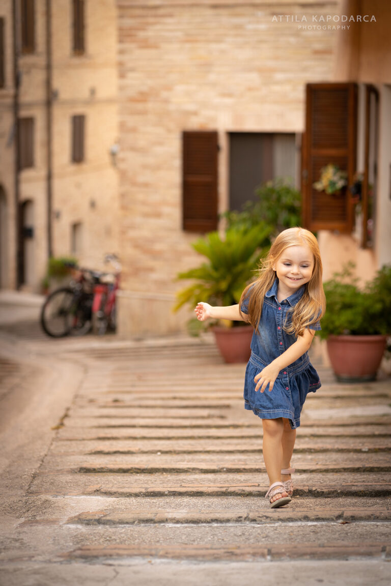 Happy kid on vacation captured by Budapest photographer for tourists in Porto San Giorgio