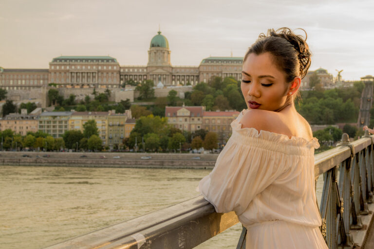 Budapest photographer for tourists captures woman tourist by Danube