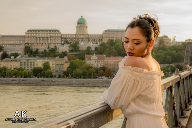 Budapest photographer for tourists captures woman tourist by Danube