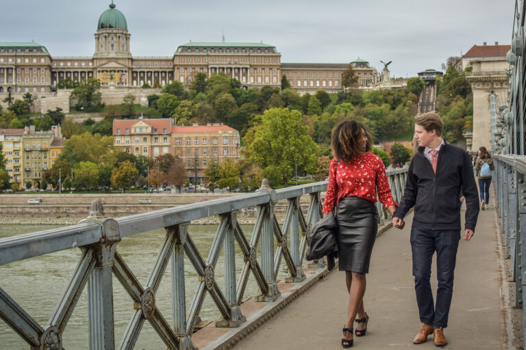 Budapest photographer for tourists captures sweet couple on Danube and castle
