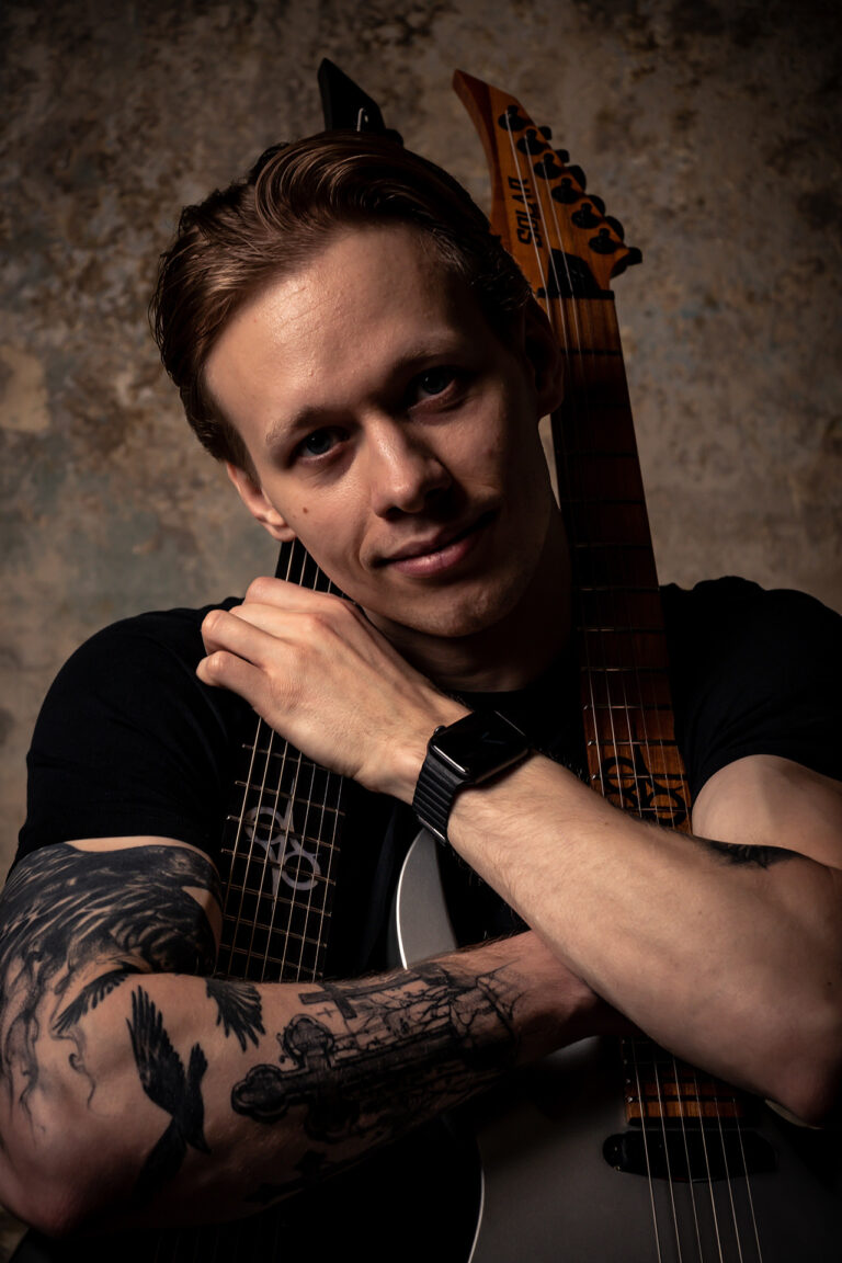 A musician man poses in studio