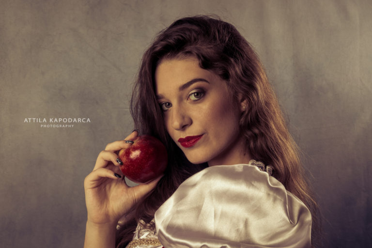 Beautiful Hungarian woman with apple by Attila Kapodarca Photographer Budapest